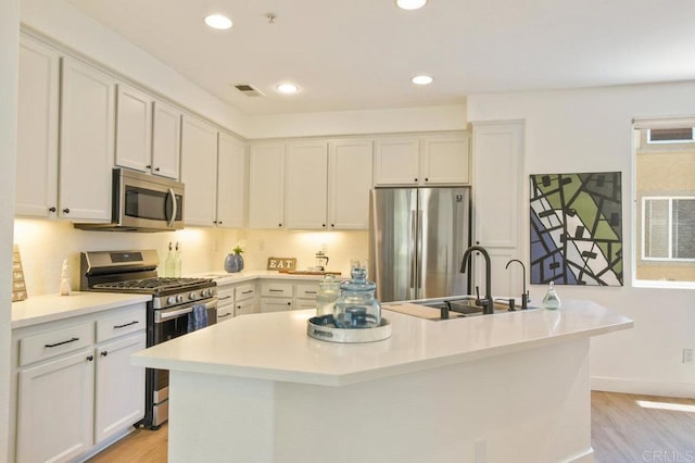 1948 Caminito De La Cruz, Chula Vista, CA 91913 - kitchen featuring stainless steel appliances, light wood-style flooring, recessed lighting, and light countertops