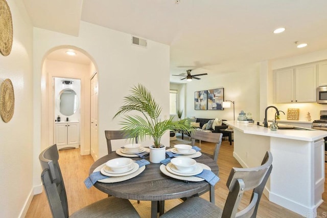 1948 Caminito De La Cruz, Chula Vista, CA 91913 - dining space featuring a ceiling fan, light wood finished floors, arched walkways, and recessed lighting