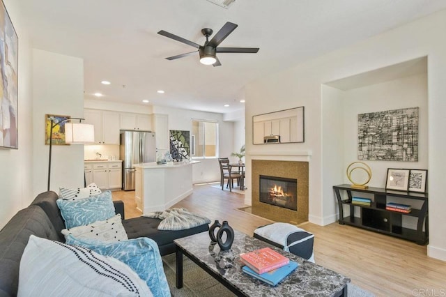 1948 Caminito De La Cruz, Chula Vista, CA 91913 - living room with light wood finished floors, a ceiling fan, a fireplace, and recessed lighting