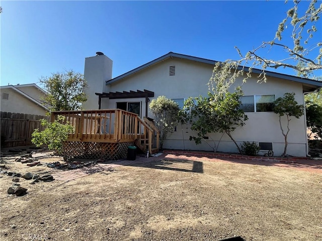1039 Maple St, Arroyo Grande, CA 93420 - back of property featuring a deck, stucco siding, and a chimney