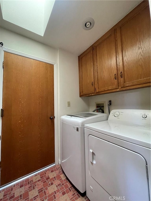 1039 Maple St, Arroyo Grande, CA 93420 - washroom featuring cabinet space, separate washer and dryer, brick patterned flooring, and a skylight