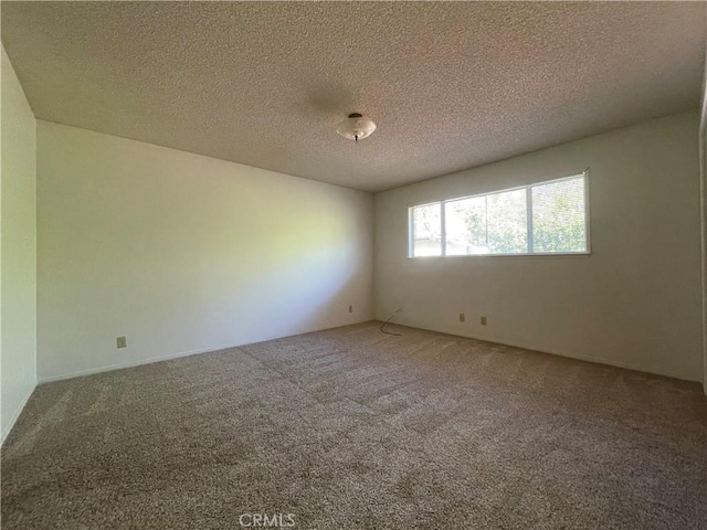 1039 Maple St, Arroyo Grande, CA 93420 - spare room featuring carpet flooring and a textured ceiling