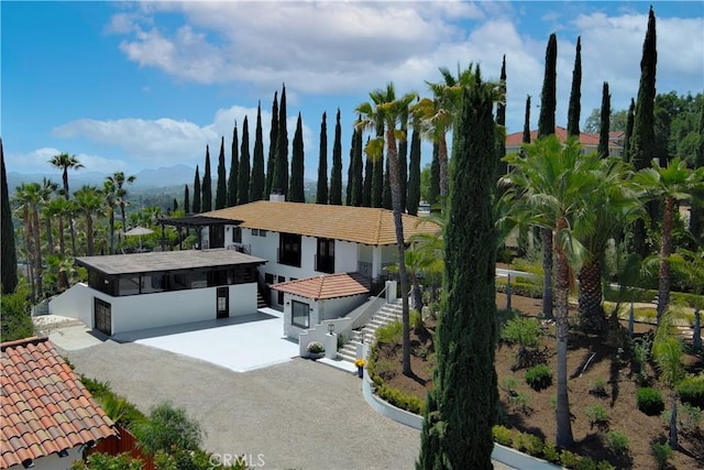 567 Lone Oak Dr, Thousand Oaks, CA 91362 - view of front of home featuring a tiled roof, stairs, and stucco siding