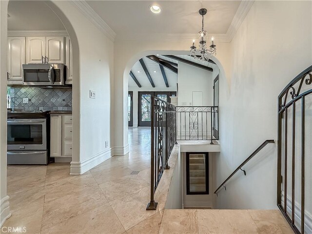 567 Lone Oak Dr, Thousand Oaks, CA 91362 - stairway with arched walkways, a chandelier, recessed lighting, and crown molding