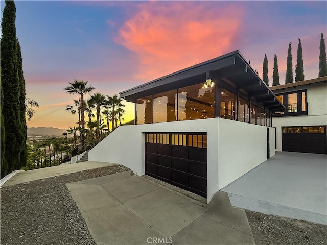 567 Lone Oak Dr, Thousand Oaks, CA 91362 - property exterior at dusk featuring stucco siding