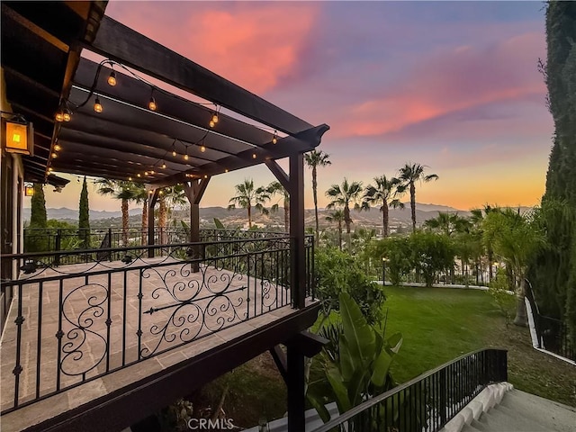 567 Lone Oak Dr, Thousand Oaks, CA 91362 - patio terrace at dusk featuring a mountain view and a pergola