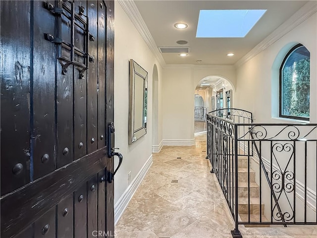 567 Lone Oak Dr, Thousand Oaks, CA 91362 - foyer with a skylight, ornamental molding, arched walkways, and recessed lighting