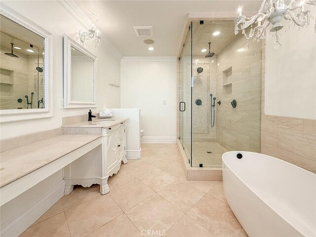 567 Lone Oak Dr, Thousand Oaks, CA 91362 - full bath featuring a stall shower, vanity, a soaking tub, ornamental molding, and tile patterned flooring