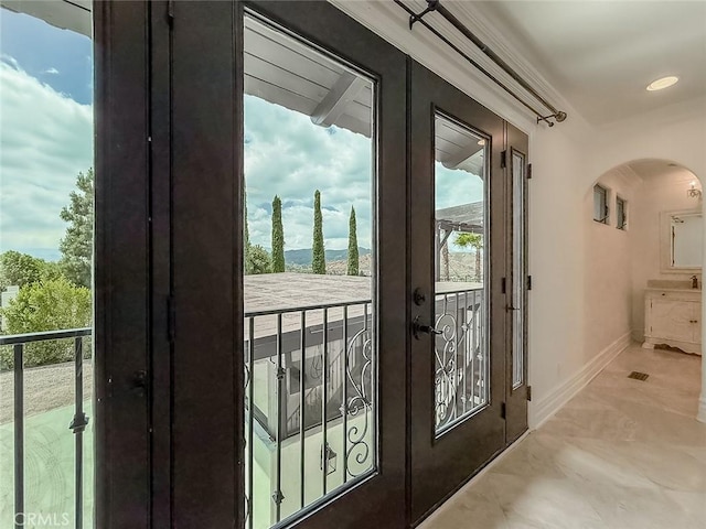 567 Lone Oak Dr, Thousand Oaks, CA 91362 - doorway featuring arched walkways, french doors, healthy amount of natural light, marble finish flooring, and recessed lighting