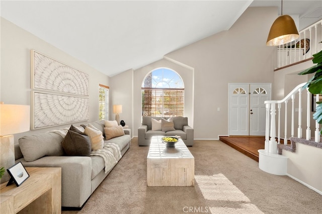 41024 Montelena Cir, Temecula, CA 92591 - carpeted living room featuring stairway and high vaulted ceiling