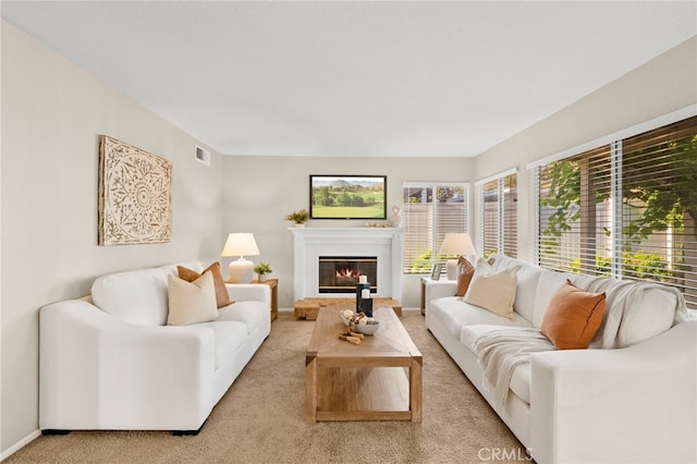 41024 Montelena Cir, Temecula, CA 92591 - living area with light carpet and a glass covered fireplace