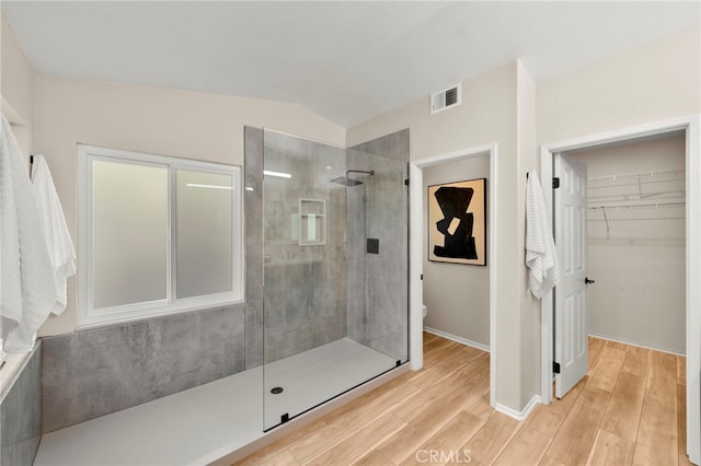 41024 Montelena Cir, Temecula, CA 92591 - full bath featuring a tile shower, wood finished floors, and a walk in closet