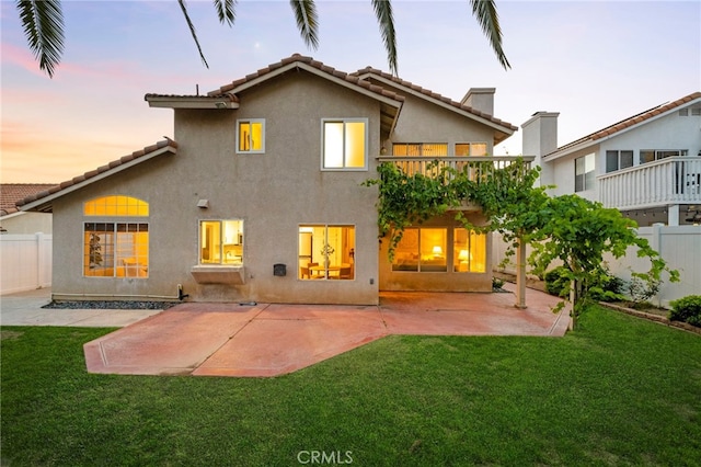 41024 Montelena Cir, Temecula, CA 92591 - back of property at dusk featuring a tiled roof, stucco siding, and a patio