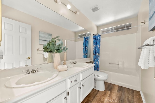 41024 Montelena Cir, Temecula, CA 92591 - full bath featuring shower / bath combo with shower curtain, double vanity, and wood finished floors