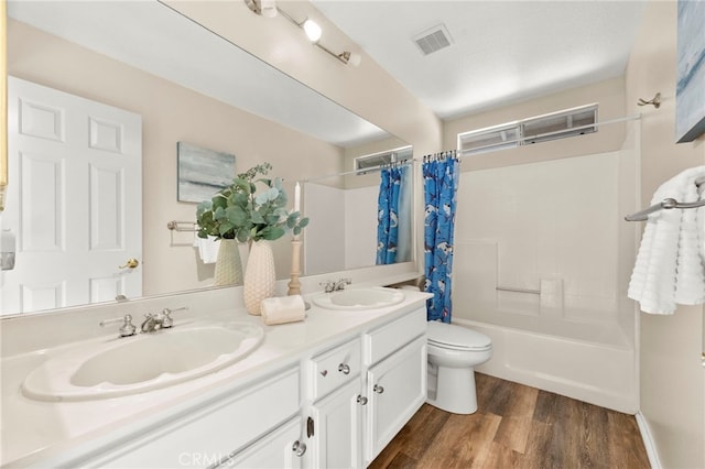 41024 Montelena Cir, Temecula, CA 92591 - bathroom with double vanity, shower / bathtub combination with curtain, and wood finished floors