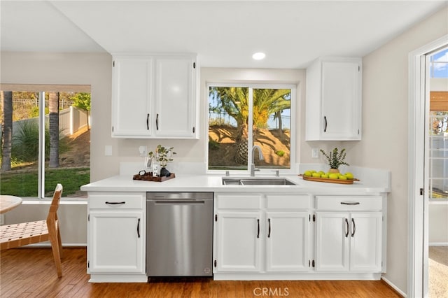 41024 Montelena Cir, Temecula, CA 92591 - kitchen featuring stainless steel dishwasher, light countertops, light wood-style floors, and recessed lighting