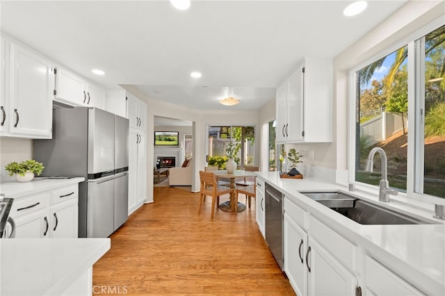 41024 Montelena Cir, Temecula, CA 92591 - kitchen with plenty of natural light, appliances with stainless steel finishes, light countertops, and recessed lighting