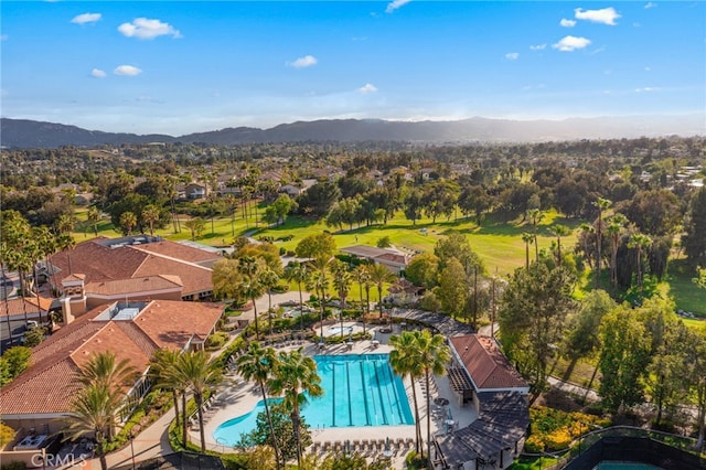 41024 Montelena Cir, Temecula, CA 92591 - aerial perspective of suburban area featuring a pool and a mountainous background