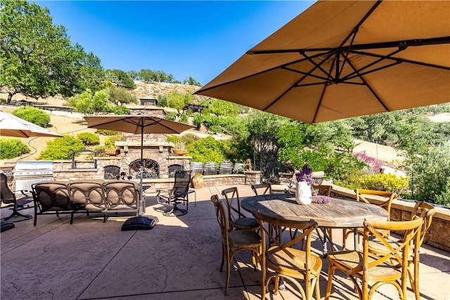 9942 Sunfish Cir, Paso Robles, CA 93446 - view of patio with outdoor dining area and an outdoor living space with a fireplace