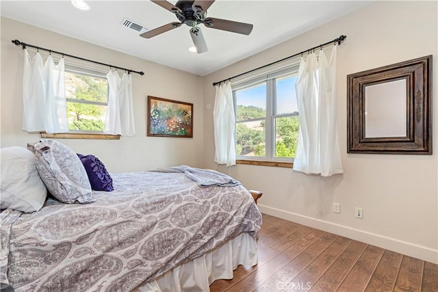 9942 Sunfish Cir, Paso Robles, CA 93446 - bedroom with multiple windows, wood finished floors, recessed lighting, and a ceiling fan