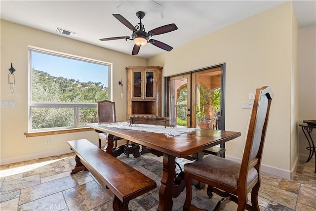 9942 Sunfish Cir, Paso Robles, CA 93446 - dining space with stone tile floors, healthy amount of natural light, ceiling fan, and french doors