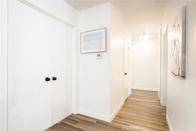 6772 Rook Dr, Huntington Beach, CA 92647 - hall featuring light wood-type flooring and baseboards