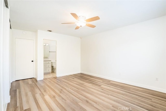 6772 Rook Dr, Huntington Beach, CA 92647 - unfurnished bedroom with light wood finished floors, connected bathroom, and a ceiling fan