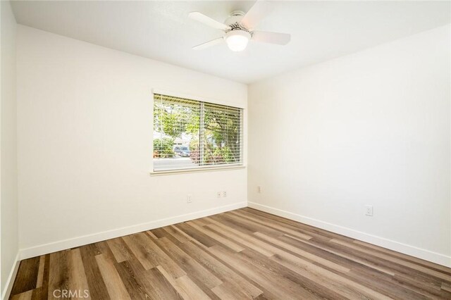 6772 Rook Dr, Huntington Beach, CA 92647 - spare room featuring wood finished floors and baseboards