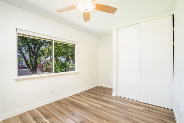 6772 Rook Dr, Huntington Beach, CA 92647 - unfurnished bedroom with light wood-type flooring, a closet, and a ceiling fan