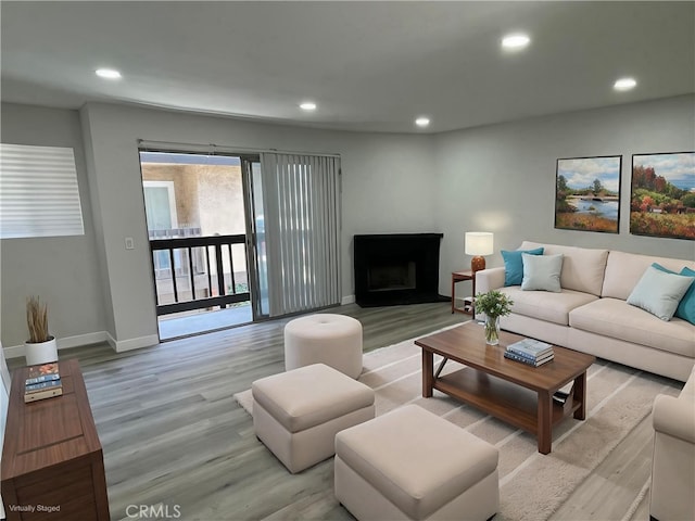 1540 Potrero Grande Dr Unit A, Rosemead, CA 91770 - living room with light wood-type flooring, recessed lighting, and a fireplace with raised hearth
