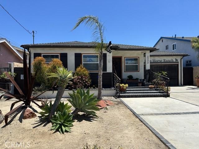 2322 249th St, Lomita, CA 90717 - view of front of property featuring a garage, concrete driveway, and stucco siding
