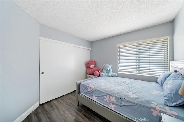 13555 Via, San Remo, Chino Hills, CA 91709 - bedroom featuring wood finished floors, a textured ceiling, and a closet