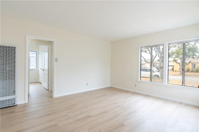 1534 W 154th Pl, Gardena, CA 90247 - unfurnished room with a heating unit and light wood-type flooring