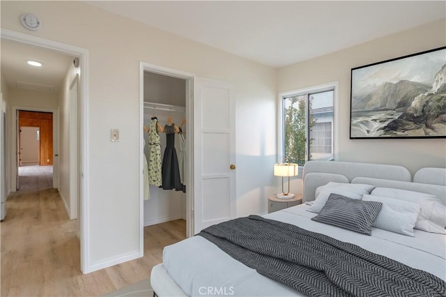 1534 W 154th Pl, Gardena, CA 90247 - bedroom featuring light wood-style flooring, a closet, and a walk in closet