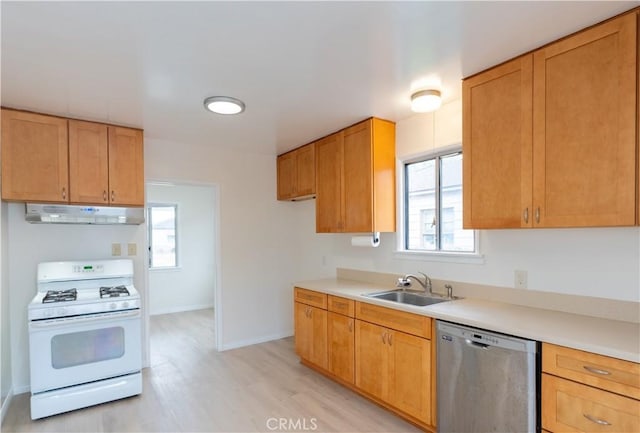 1534 W 154th Pl, Gardena, CA 90247 - kitchen with dishwasher, white range with gas stovetop, under cabinet range hood, light wood finished floors, and light countertops