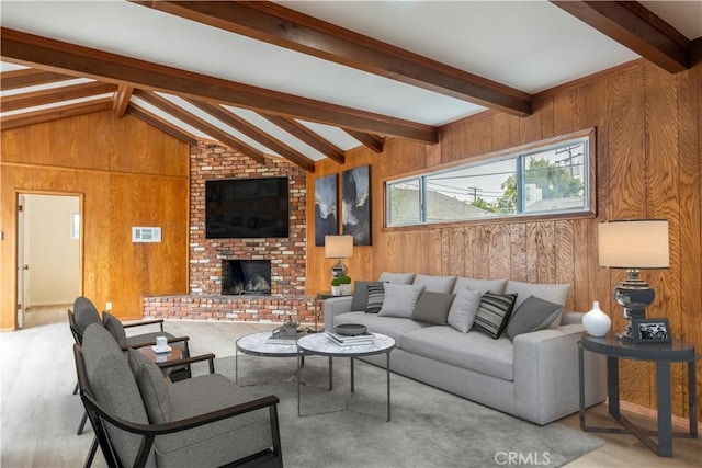 1534 W 154th Pl, Gardena, CA 90247 - living room with wood walls, a fireplace, and wood finished floors