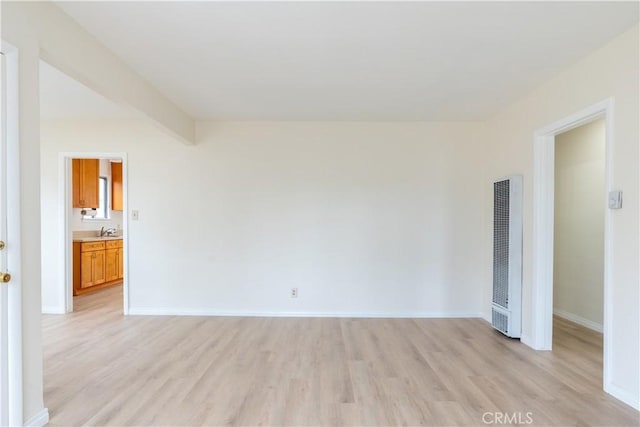 1534 W 154th Pl, Gardena, CA 90247 - unfurnished room featuring light wood-style flooring and a heating unit