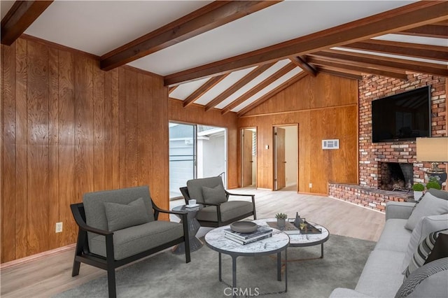 1534 W 154th Pl, Gardena, CA 90247 - living room with wood walls, a brick fireplace, and wood finished floors