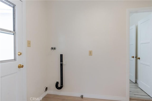 1534 W 154th Pl, Gardena, CA 90247 - washroom featuring baseboards and light wood finished floors