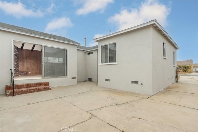 1534 W 154th Pl, Gardena, CA 90247 - back of property with a patio, crawl space, and stucco siding