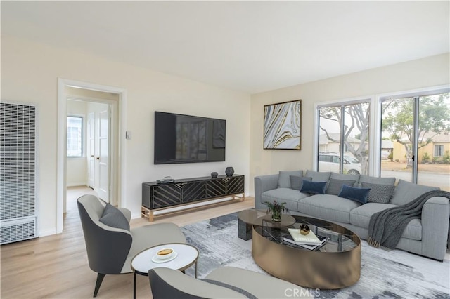 1534 W 154th Pl, Gardena, CA 90247 - living room featuring a heating unit and light wood-style floors