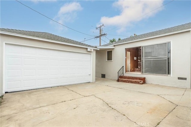 1534 W 154th Pl, Gardena, CA 90247 - rear view of property with stucco siding, driveway, and an attached garage