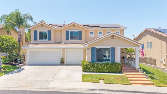 3720 Gunnison Cir, Corona, CA 92881 - mediterranean / spanish house featuring driveway, an attached garage, stucco siding, a tile roof, and solar panels