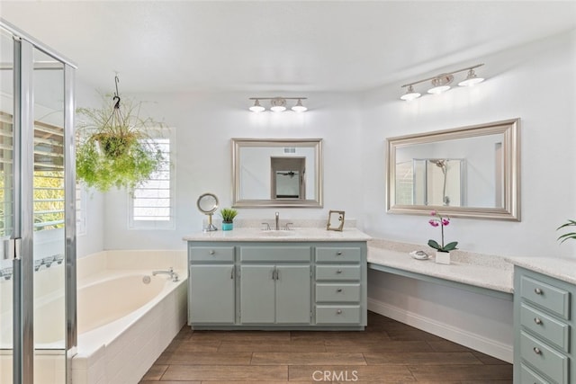 3720 Gunnison Cir, Corona, CA 92881 - bathroom featuring vanity, a bath, and wood finished floors