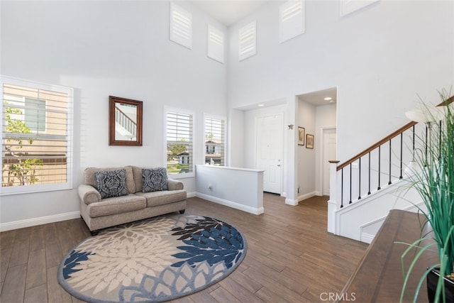 3720 Gunnison Cir, Corona, CA 92881 - living area featuring wood finished floors, stairway, and a towering ceiling