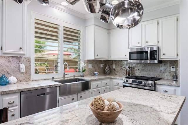 3720 Gunnison Cir, Corona, CA 92881 - kitchen featuring stainless steel appliances, ornamental molding, white cabinetry, decorative backsplash, and light stone countertops