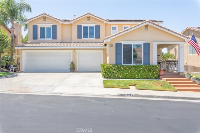 3720 Gunnison Cir, Corona, CA 92881 - view of front of home with a garage, driveway, roof mounted solar panels, and a tiled roof