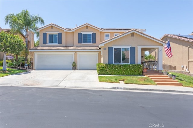 3720 Gunnison Cir, Corona, CA 92881 - view of front of property with an attached garage, solar panels, a tiled roof, stucco siding, and concrete driveway