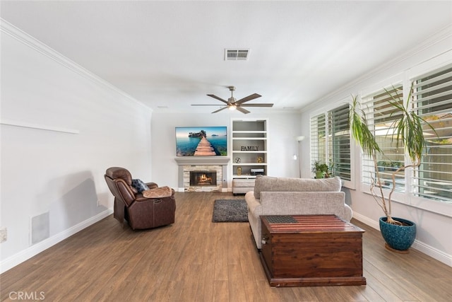 3720 Gunnison Cir, Corona, CA 92881 - living area with crown molding, a stone fireplace, wood finished floors, and a ceiling fan