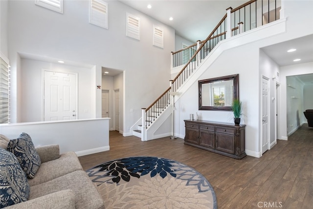 3720 Gunnison Cir, Corona, CA 92881 - living area with wood finished floors, stairway, a towering ceiling, and recessed lighting
